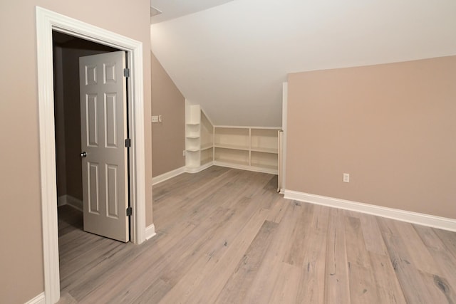 spare room featuring dark wood-type flooring, crown molding, and a tray ceiling