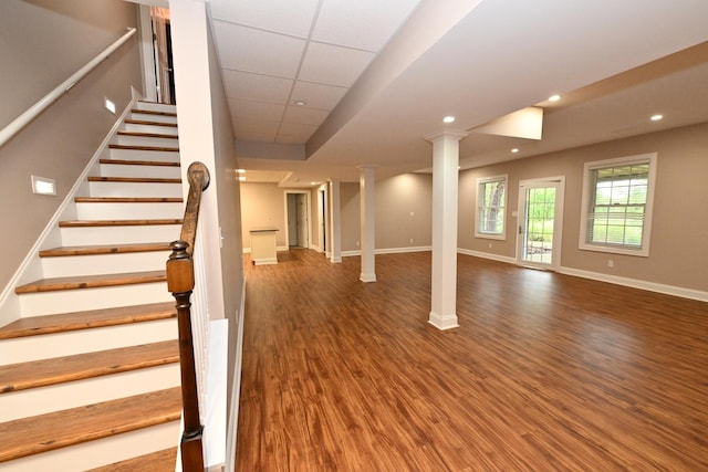 bonus room with hardwood / wood-style floors and vaulted ceiling