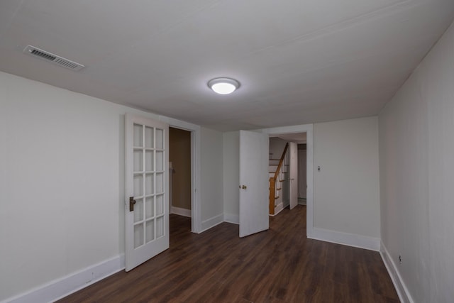 spare room with dark hardwood / wood-style flooring