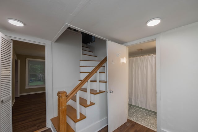 stairway featuring hardwood / wood-style flooring