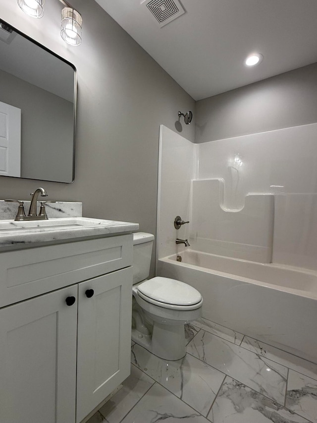 full bathroom featuring toilet, vanity, and shower / bathing tub combination