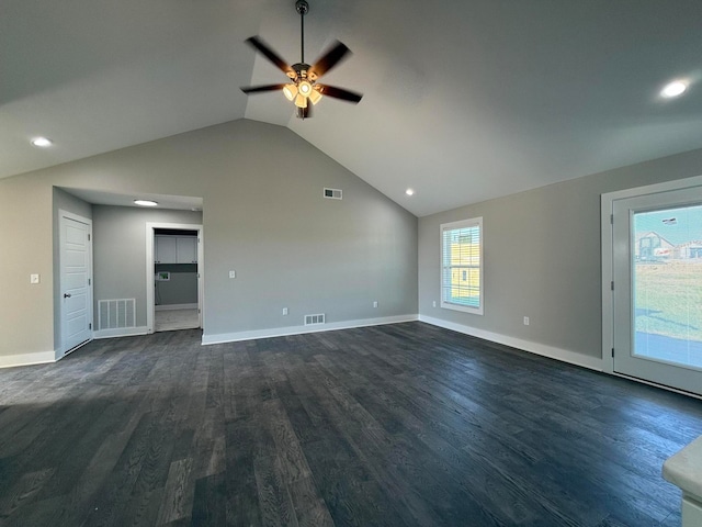 unfurnished living room featuring dark wood-type flooring, vaulted ceiling, and ceiling fan