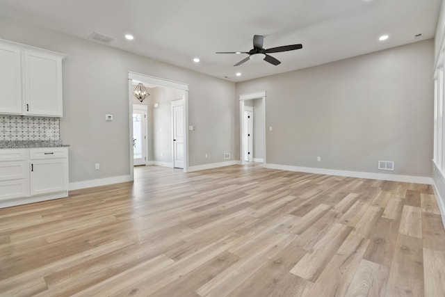 unfurnished living room with recessed lighting, visible vents, and light wood-style floors