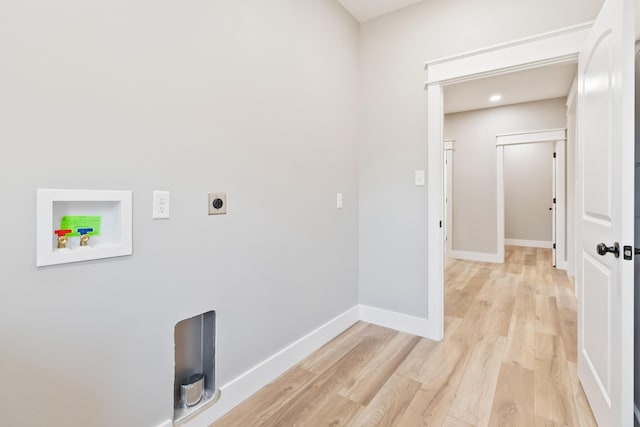 laundry area with light wood-style floors, hookup for a washing machine, electric dryer hookup, and baseboards