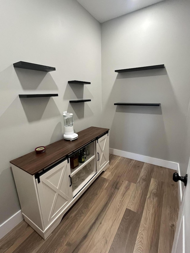 interior details with wood finished floors and baseboards