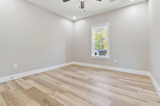 spare room with recessed lighting, visible vents, light wood-style flooring, a ceiling fan, and baseboards