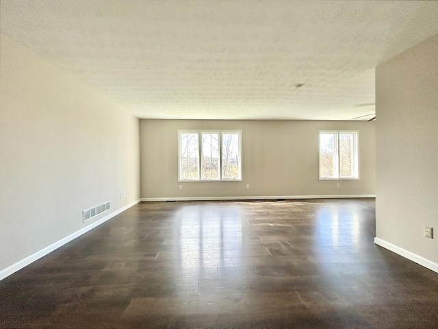 empty room with a textured ceiling