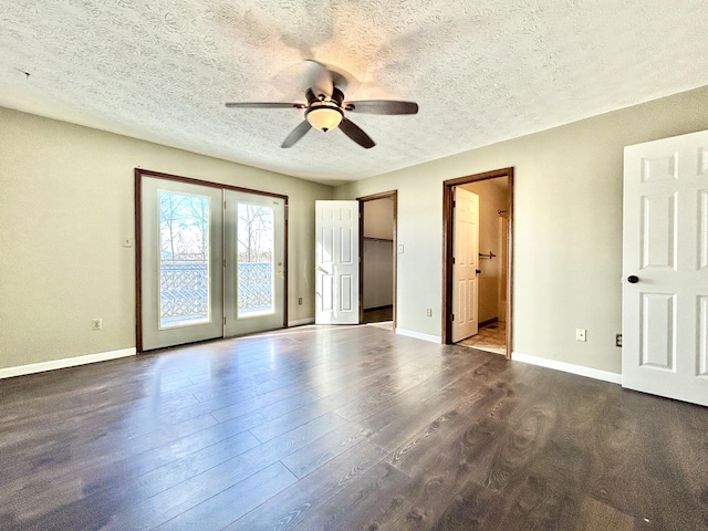 unfurnished bedroom with ceiling fan, dark hardwood / wood-style flooring, ensuite bathroom, and a textured ceiling