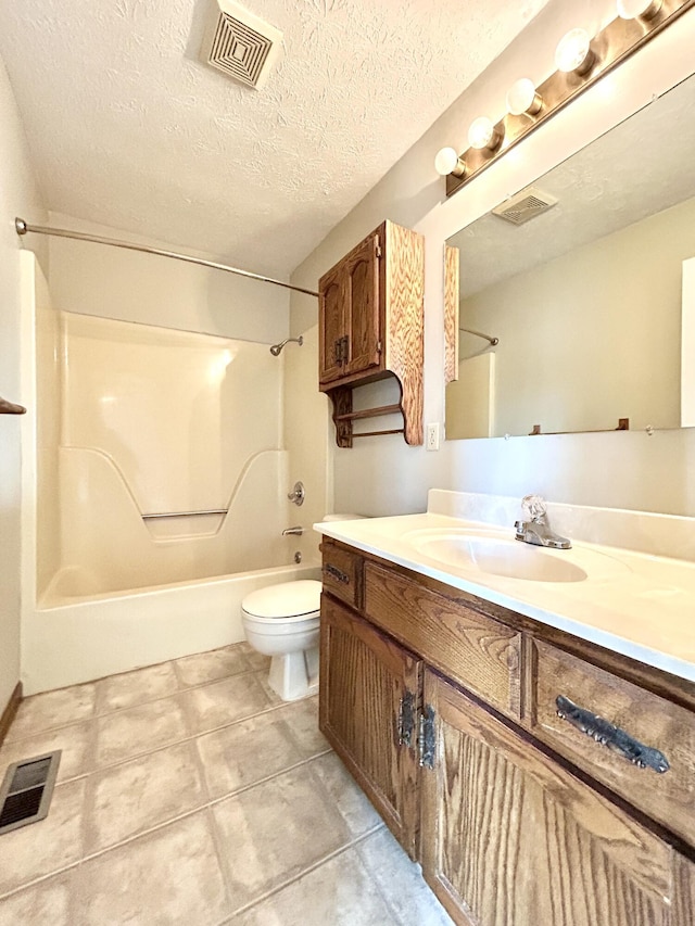 full bathroom featuring toilet, vanity, a textured ceiling, and tub / shower combination