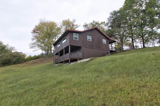back of property featuring a yard