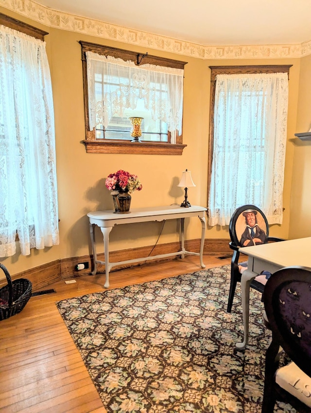 office space with hardwood / wood-style flooring