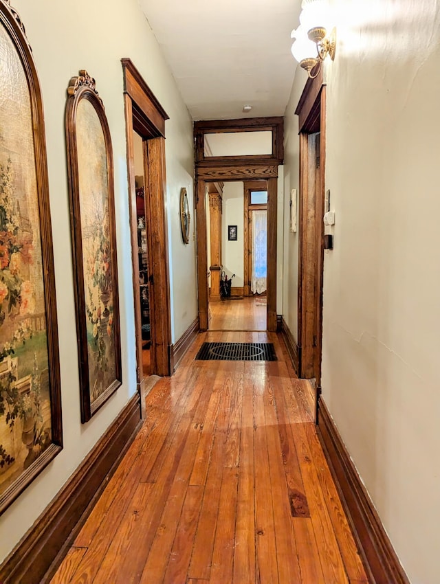 corridor featuring wood-type flooring