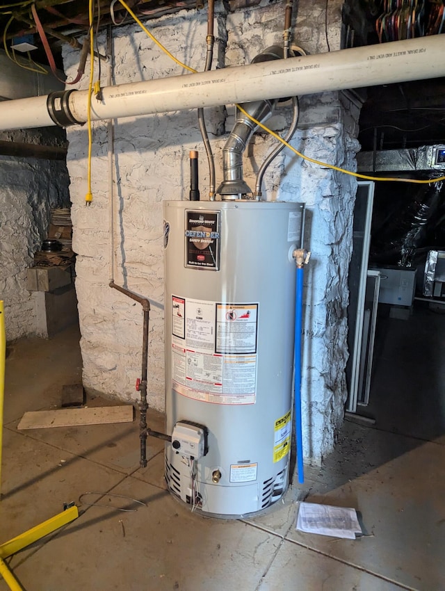 utility room featuring water heater