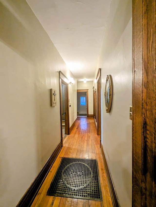 hall with light hardwood / wood-style flooring