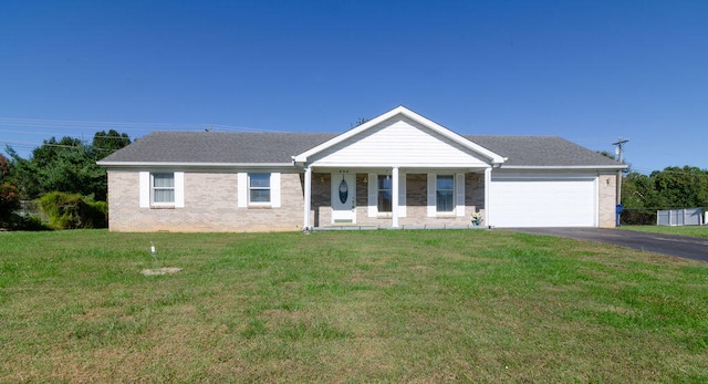 ranch-style house with a front lawn and a garage