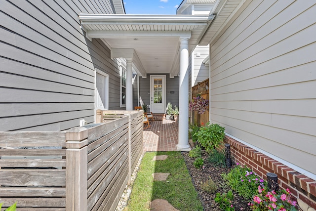 entrance to property featuring covered porch