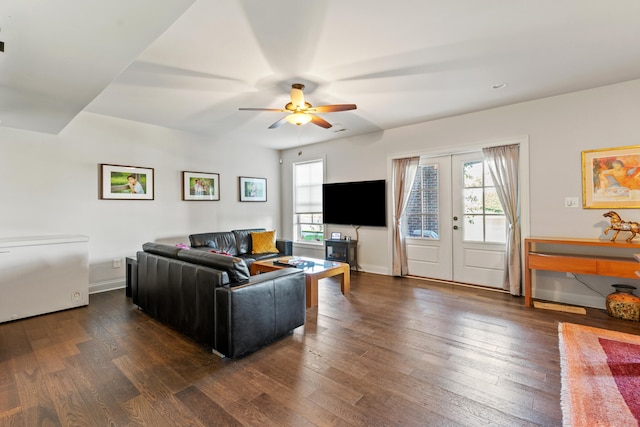 living room featuring french doors, dark hardwood / wood-style flooring, and ceiling fan