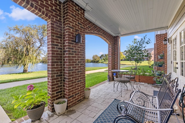 view of patio featuring a water view