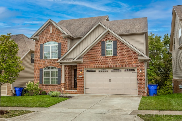 view of front of home featuring a garage and a front lawn