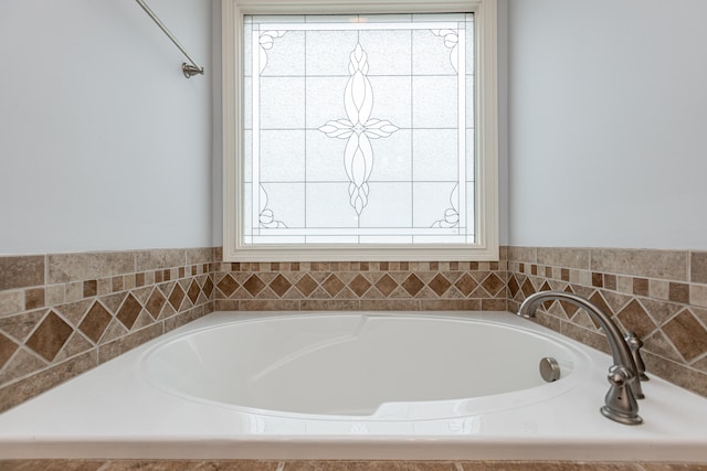 bathroom with a tub to relax in