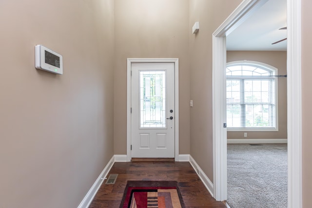 interior space featuring ceiling fan and dark wood-type flooring