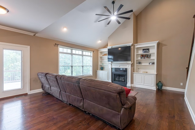 living room with dark hardwood / wood-style floors, ceiling fan, and high vaulted ceiling