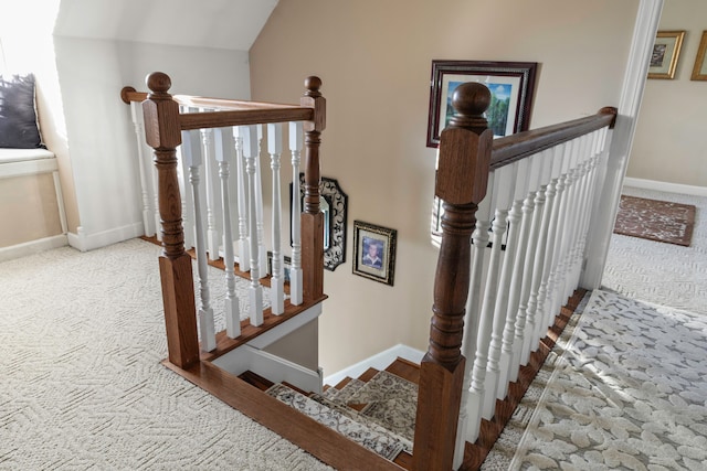 stairs featuring vaulted ceiling and carpet floors