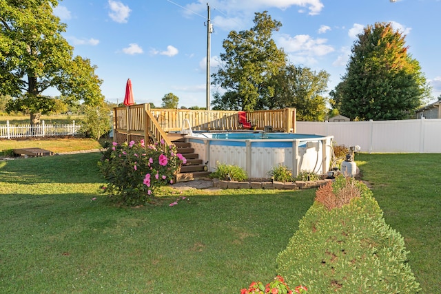 view of yard with a swimming pool side deck