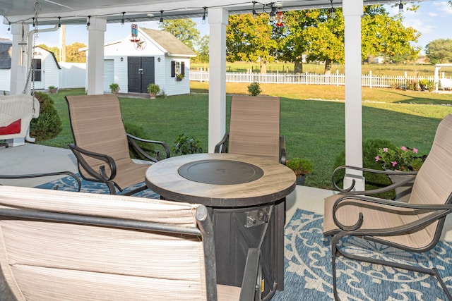 view of patio / terrace with a shed