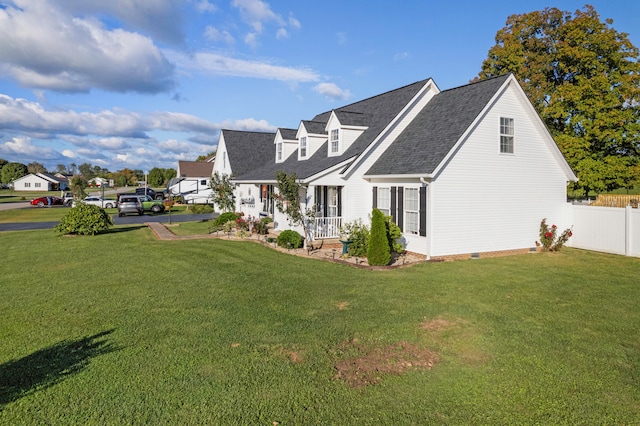 view of side of property featuring a lawn