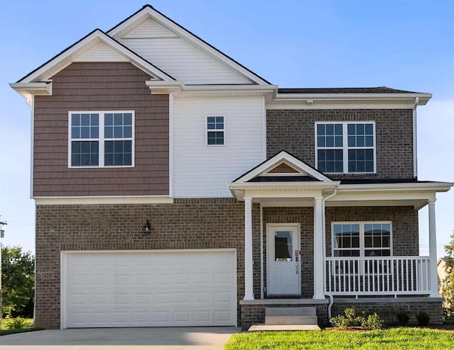 view of front facade with driveway, a porch, an attached garage, and brick siding