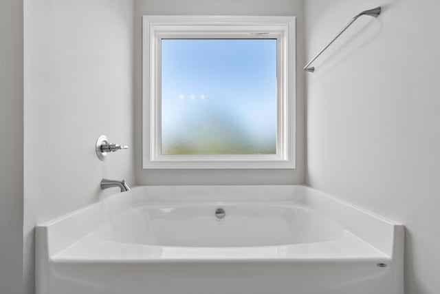 bathroom featuring a garden tub