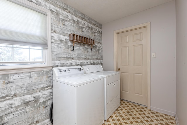 laundry area with independent washer and dryer