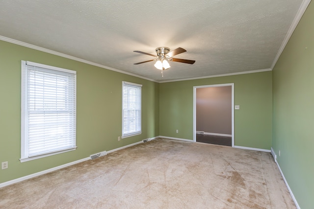 empty room with light carpet, a textured ceiling, plenty of natural light, and ceiling fan