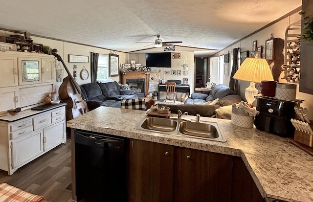 kitchen featuring dishwasher, crown molding, dark hardwood / wood-style flooring, and a textured ceiling