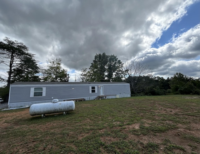 back of house with a yard