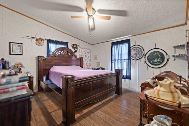 bedroom featuring ceiling fan, ornamental molding, a textured ceiling, dark hardwood / wood-style floors, and vaulted ceiling