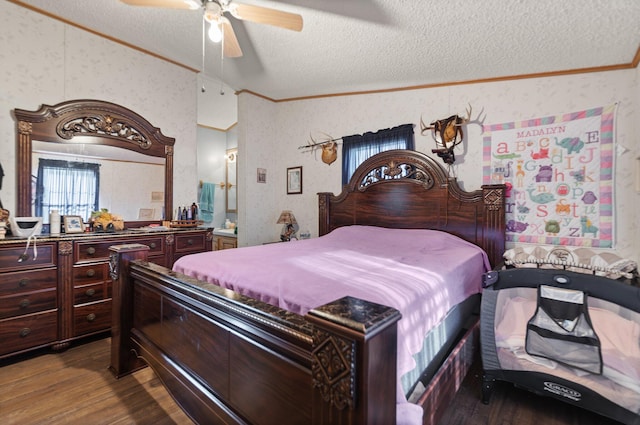 bedroom with ceiling fan, a textured ceiling, and dark hardwood / wood-style floors