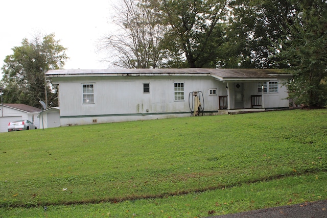 back of house with a yard