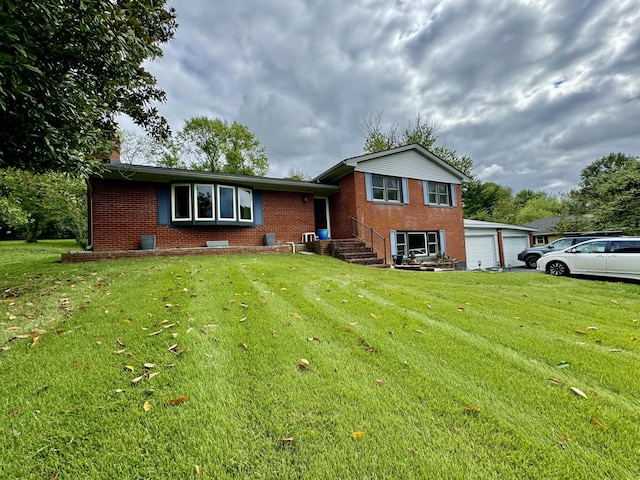 tri-level home featuring a garage and a front yard