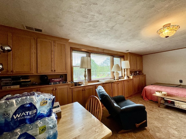 interior space with a textured ceiling