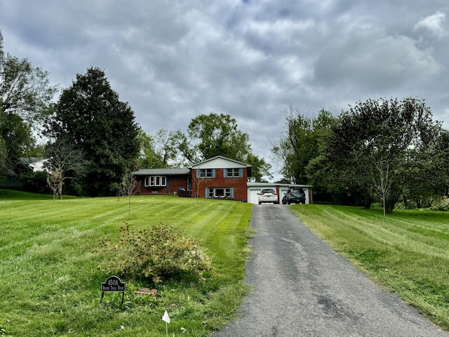 view of front of property featuring a front lawn and brick siding