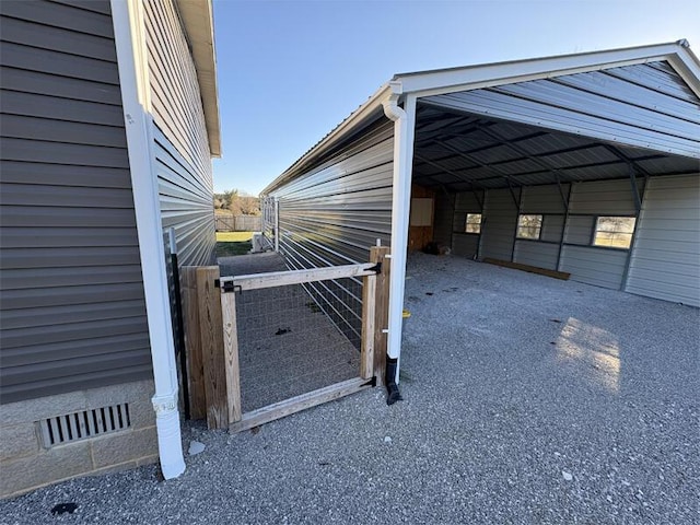 view of property exterior with a carport