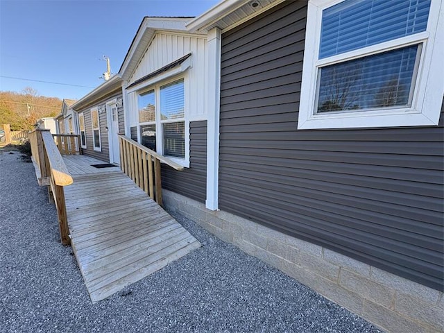 view of side of property with a deck