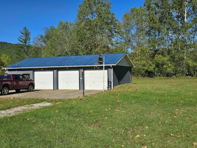 garage featuring a lawn