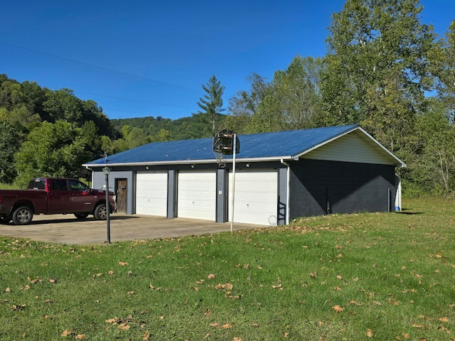 garage featuring a yard