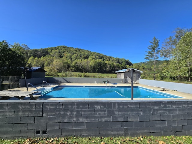 163 Eulett Ln, Vanceburg, KY 41179 - view of swimming pool with a diving board and a view of trees