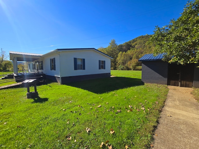 view of property exterior featuring a lawn