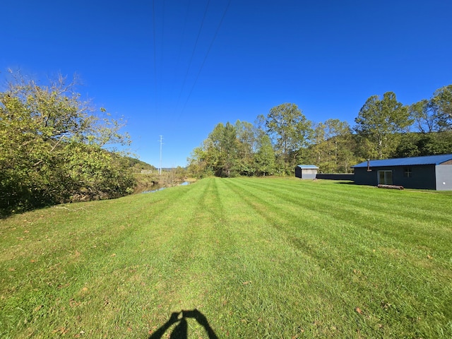 163 Eulett Ln, Vanceburg, KY 41179 - view of grassy yard with a storage shed