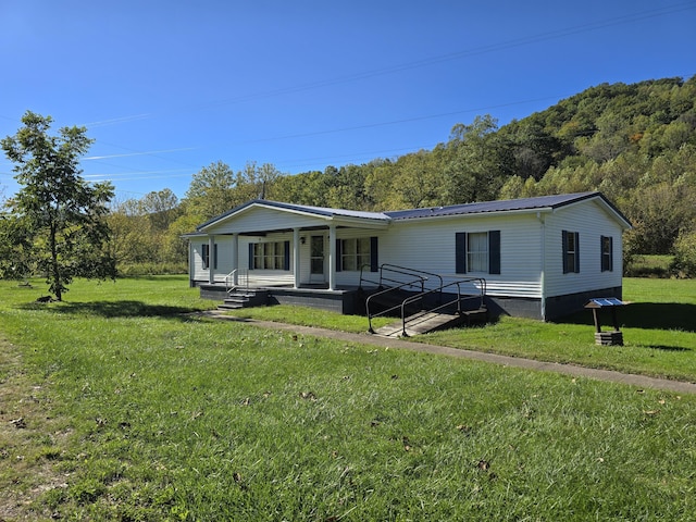 163 Eulett Ln, Vanceburg, KY 41179 - view of front of house with a porch, a front lawn, and a metal roof